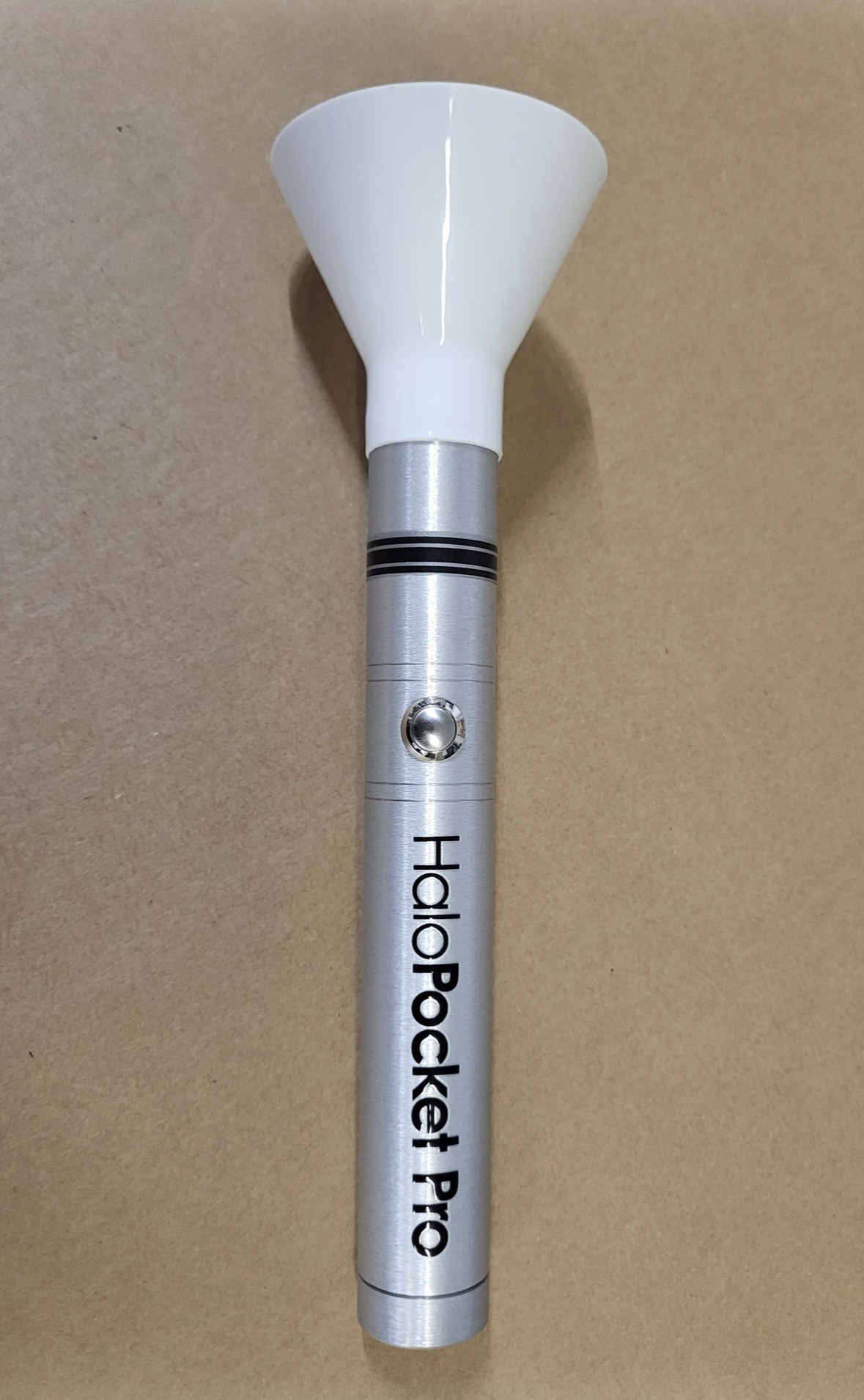 HaloPocket Pro device with white funnel on a brown background.